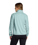 WTNFPerformanceFleece1_4Zip- Person wearing a light blue quarter zip with white North Face Logo on a white background