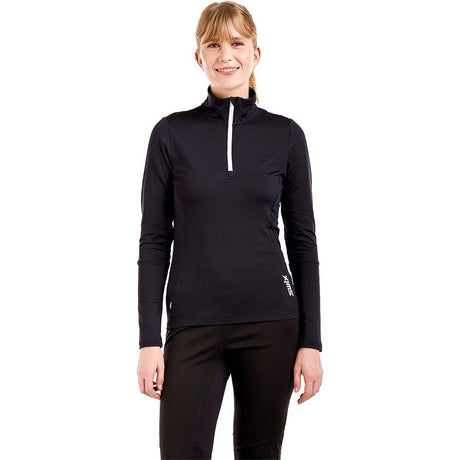 WTista1_2ZipMidlayer- A woman modeling a black long-sleeve half-zip athletic top with a white zipper pull, paired with black leggings, against a plain white background.