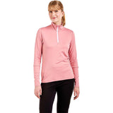 WTista1_2ZipMidlayer- A woman modeling a pink long-sleeve half-zip athletic top with a white zipper pull, paired with black leggings, against a plain white background.