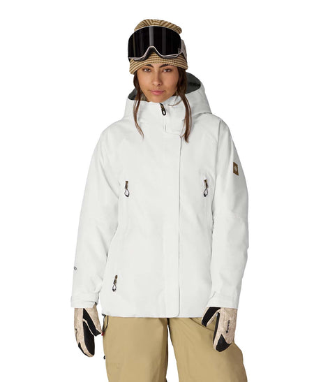 WWhisperInsulatedJacket-Person wearing a white snow jacket, beige pants, and goggles on a white background