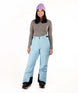 WZoeIIPant-Person wearing light blue snow pants and a gray top with a white background