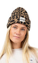 WatcherBeanie- Woman wearing a leopard designed beanie on a white background 