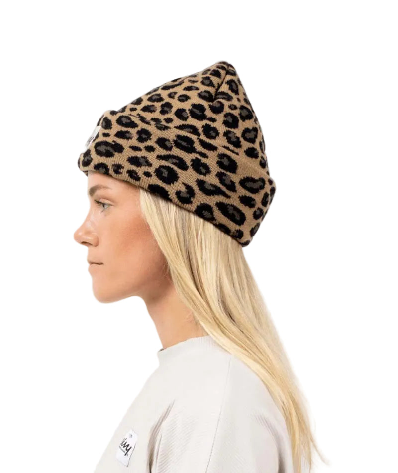 WatcherBeanie- Woman wearing a leopard designed beanie on a white background 
