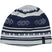 WesleyHat- A knit beanie hat featuring a geometric pattern in navy blue, light gray, and white, with a small black brand tag on the side.