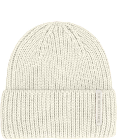 WoolBlendBeanie- White knit beanie with a brand label on a white background