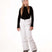 YouthGirlsRavishPant-Person wearing a black top, white pants, and gray beanie on a white background
