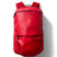 allpa-26l-daypack-A red Cotopaxi backpack with a matte finish, featuring a top zippered compartment, a main compartment, and a front zippered pocket. The brand logo is printed in orange on the front center.
