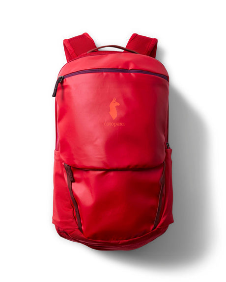 allpa-26l-daypack-A red Cotopaxi backpack with a matte finish, featuring a top zippered compartment, a main compartment, and a front zippered pocket. The brand logo is printed in orange on the front center.