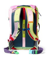 allpa-42l-travel-pack-A Cotopaxi backpack in teal blue with pink and purple accents, featuring a light blue cat logo and the brand name on the front, set against a plain white background.