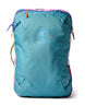 allpa-42l-travel-pack-A Cotopaxi backpack in teal blue with pink and purple accents, featuring a light blue cat logo and the brand name on the front, set against a plain white background.