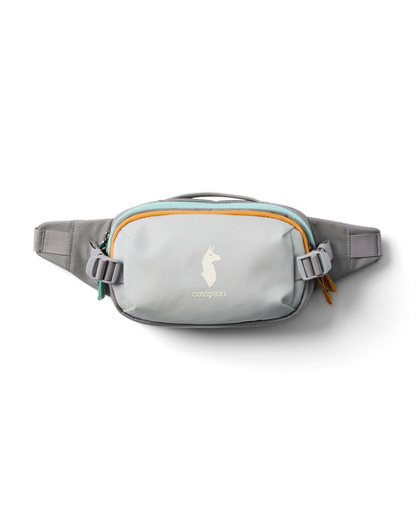 allpa-x-1-5l-hip-pack- A light gray waist bag with a mint green zipper, orange trim, and a white compact brand logo on the front, shown against a plain white background.