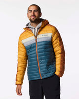 m-fuego-down-hooded-jacket- A hooded puffer jacket with a color-blocked design featuring a dark blue front, mustard yellow sides, and brown sleeves and hood, shown on a plain white background.