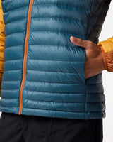 m-fuego-down-hooded-jacket- A hooded puffer jacket with a color-blocked design featuring a dark blue front, mustard yellow sides, and brown sleeves and hood, shown on a plain white background.