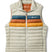 m-fuego-down-vest- A quilted puffer vest by Cotopaxi in a light beige color, featuring horizontal quilting, a full-zip front, and a mock neck collar. It has a distinctive color-blocked chest design with horizontal stripes of dark teal, rust orange, and golden yellow, with the Cotopaxi logo printed on the chest.