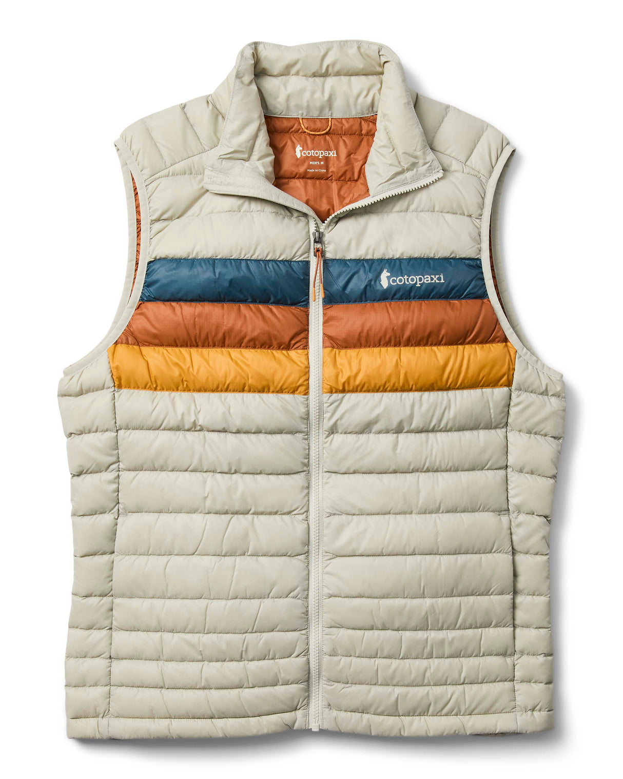 m-fuego-down-vest- A quilted puffer vest by Cotopaxi in a light beige color, featuring horizontal quilting, a full-zip front, and a mock neck collar. It has a distinctive color-blocked chest design with horizontal stripes of dark teal, rust orange, and golden yellow, with the Cotopaxi logo printed on the chest.