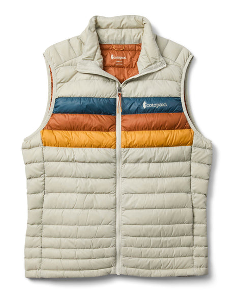 m-fuego-down-vest- A quilted puffer vest by Cotopaxi in a light beige color, featuring horizontal quilting, a full-zip front, and a mock neck collar. It has a distinctive color-blocked chest design with horizontal stripes of dark teal, rust orange, and golden yellow, with the Cotopaxi logo printed on the chest.