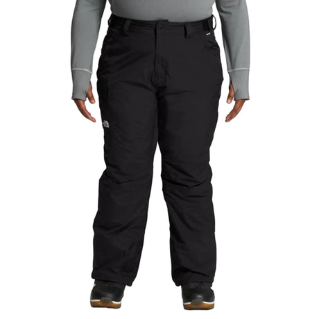 WFreedomPlusInsulatedPant- Black pants worn by a person on a white background