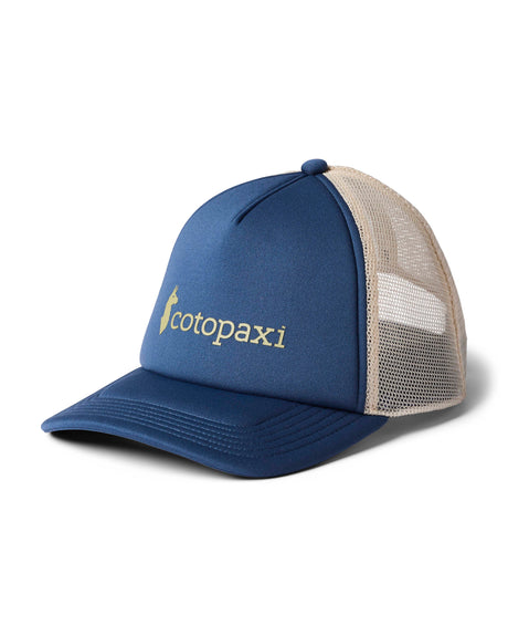 vintage-trucker-hat- A blue and beige trucker hat with a curved brim, featuring the 'cotopaxi' logo embroidered in gold on the front panel, set against a plain white background.