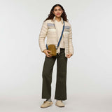 w-fuego-down-jacket- A beige quilted puffer jacket with a gray chest stripe and a visible Cotopaxi logo on the left chest, displayed against a clean white background.