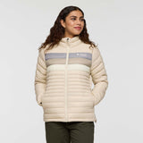 w-fuego-down-jacket- A beige quilted puffer jacket with a gray chest stripe and a visible Cotopaxi logo on the left chest, displayed against a clean white background.