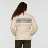 w-fuego-down-jacket- A beige quilted puffer jacket with a gray chest stripe and a visible Cotopaxi logo on the left chest, displayed against a clean white background.